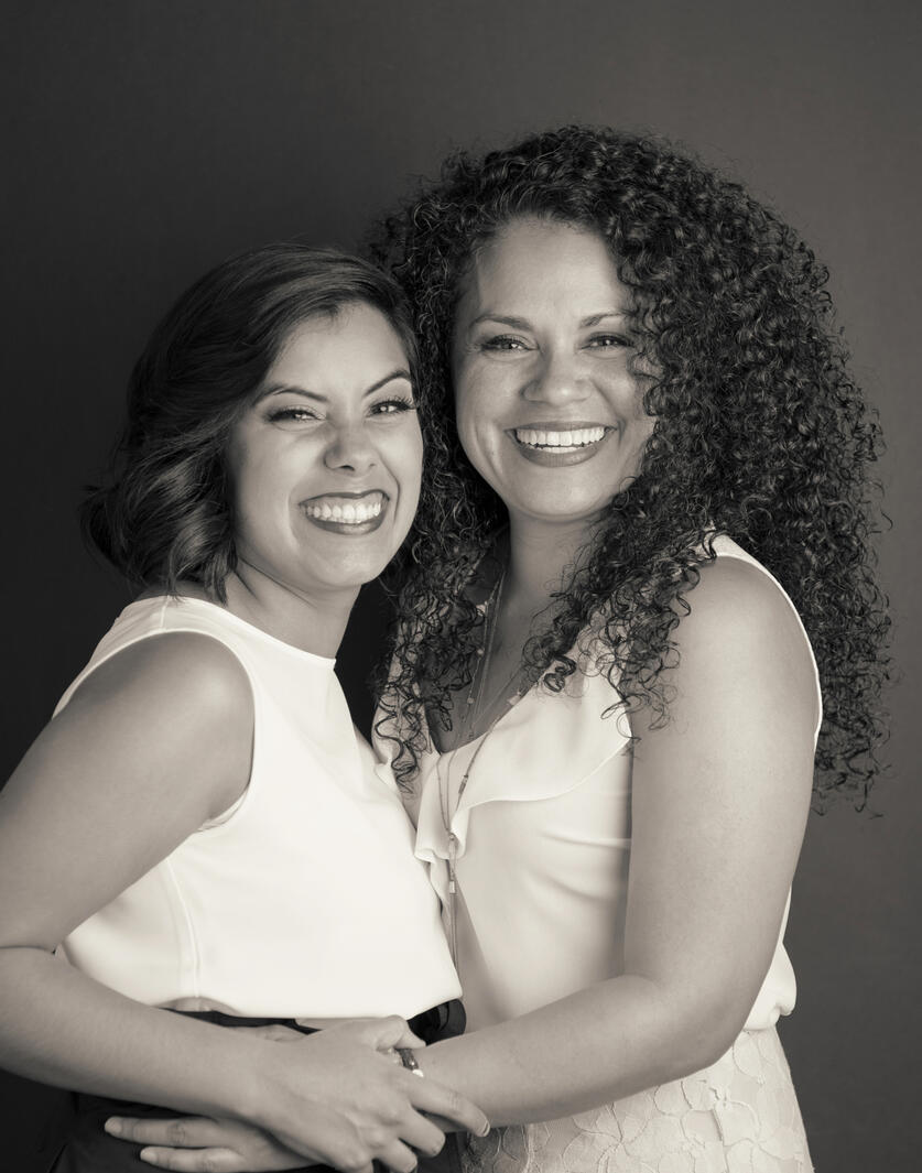 Black and white family portrait of a hispanic mother and daughter