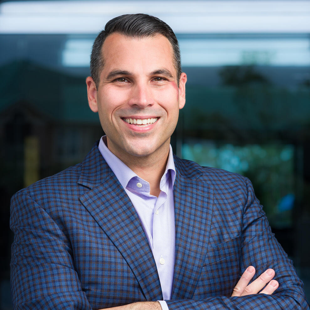 Executive headshot 40 Under 40 male RevStar revstarconsulting.com blue blazer smiling by Tampa Sidney Oster Photography