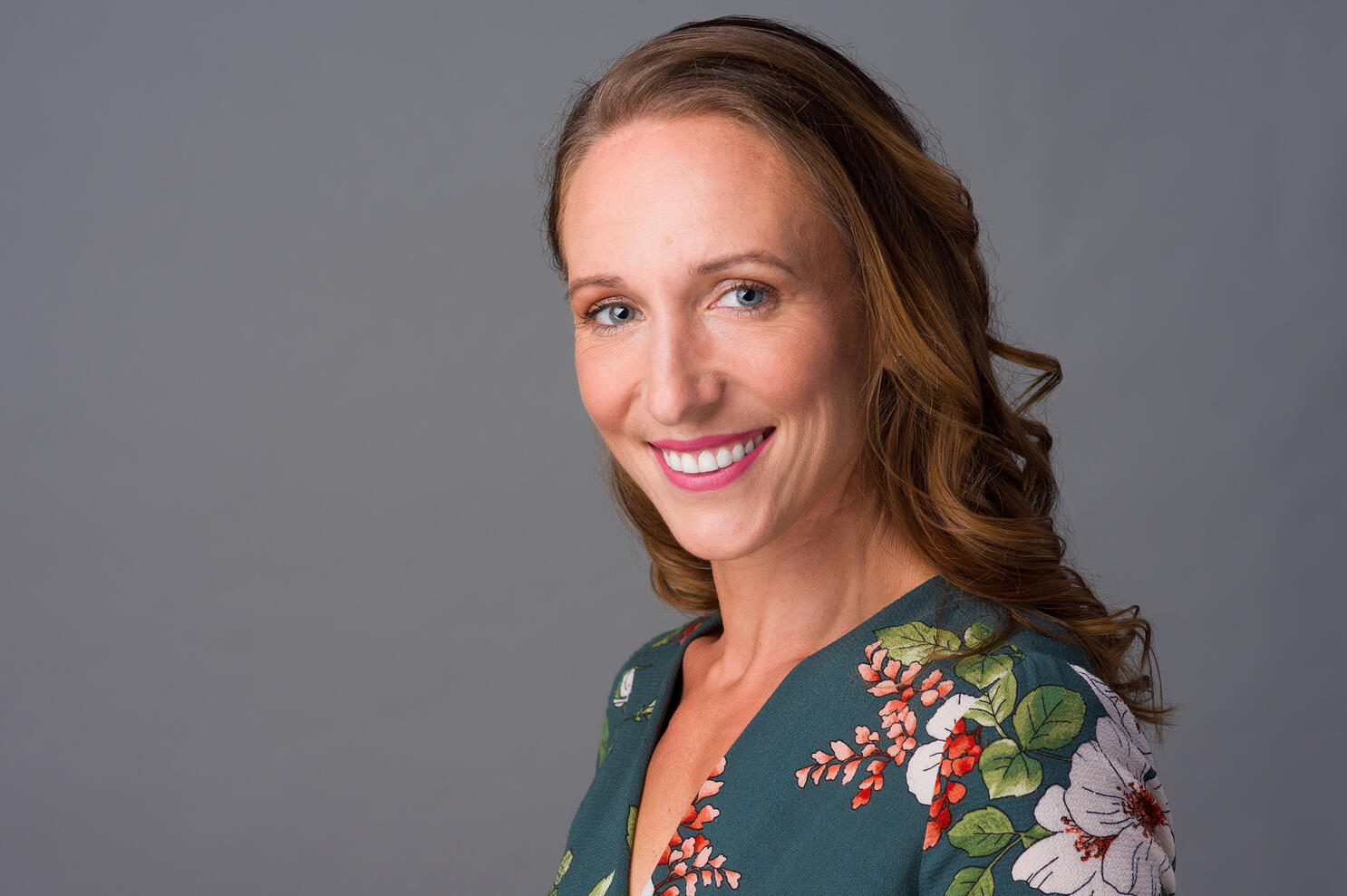 Professional headshot of smiling executive female woman by Tampa Sidney Oster Photography