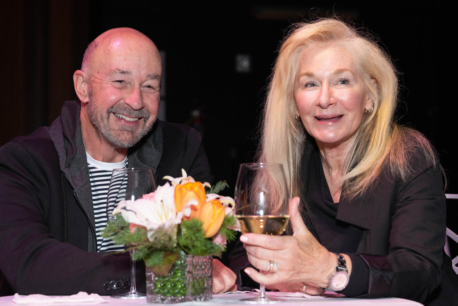 Older married couple smiling at donor event The Smith Center